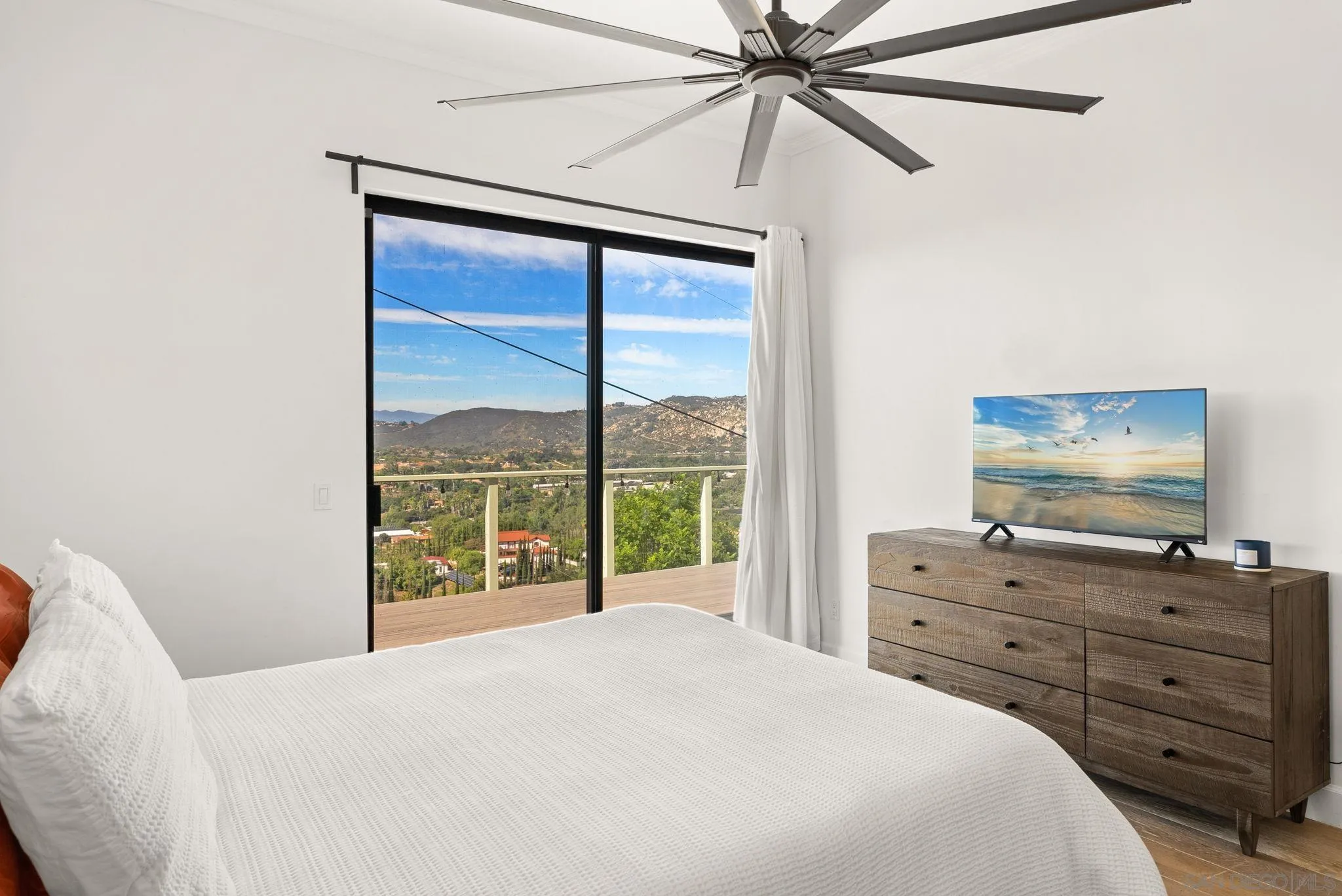 5521 Rainbow Heights Road Fallbrook, CA 92028 - Photo 21 of 36 a bedroom with a bed and a mirror
