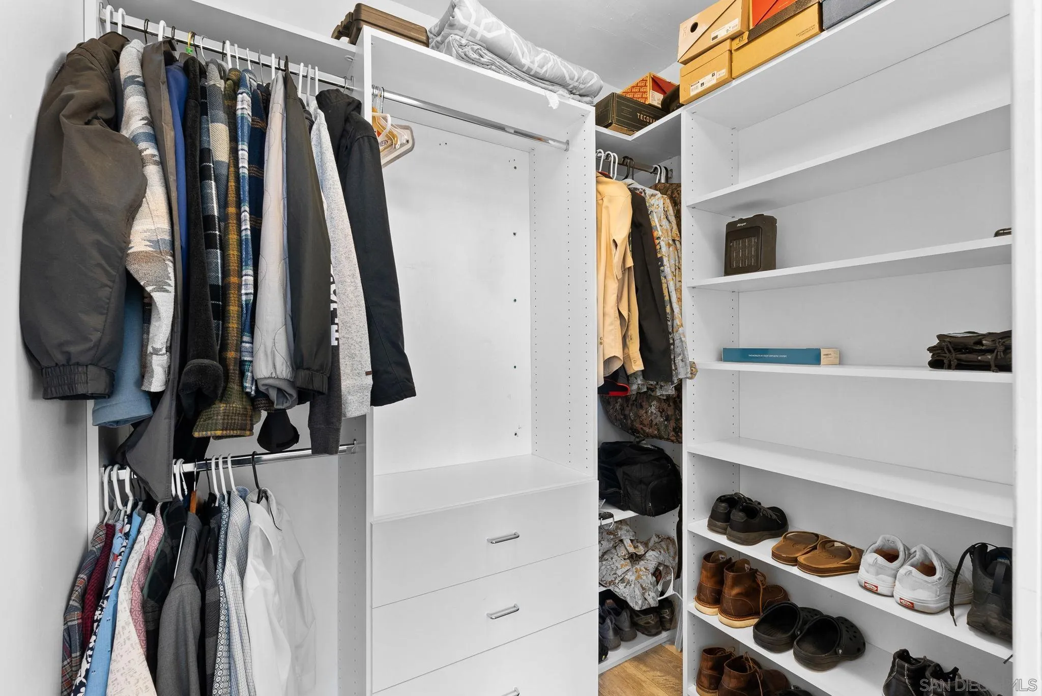 5521 Rainbow Heights Road Fallbrook, CA 92028 - Photo 25 of 36 a view of walk in closet with clothes and shoes