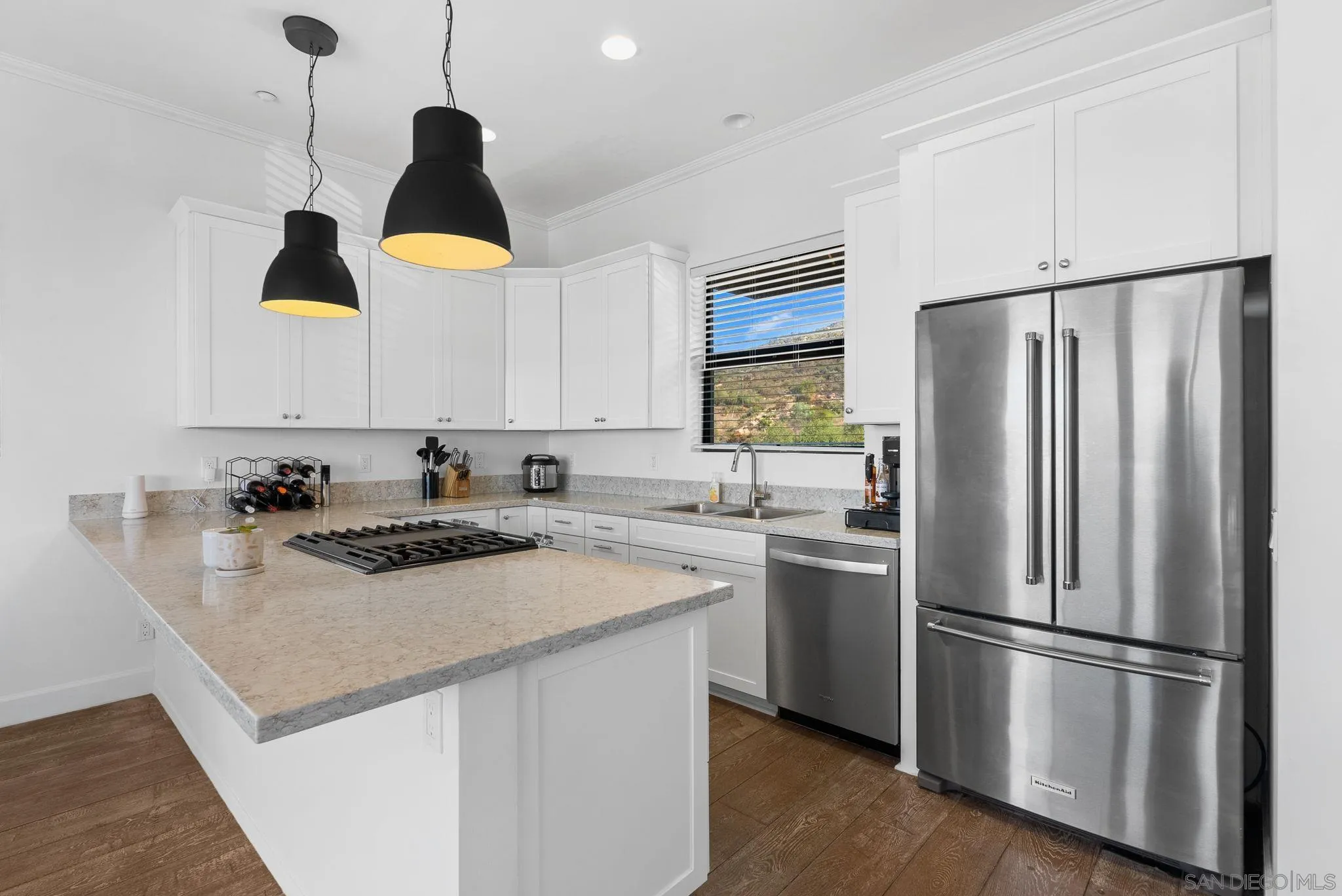5521 Rainbow Heights Road Fallbrook, CA 92028 - Photo 8 of 36 a kitchen with stainless steel appliances granite countertop a sink a stove a refrigerator and island with wooden floor