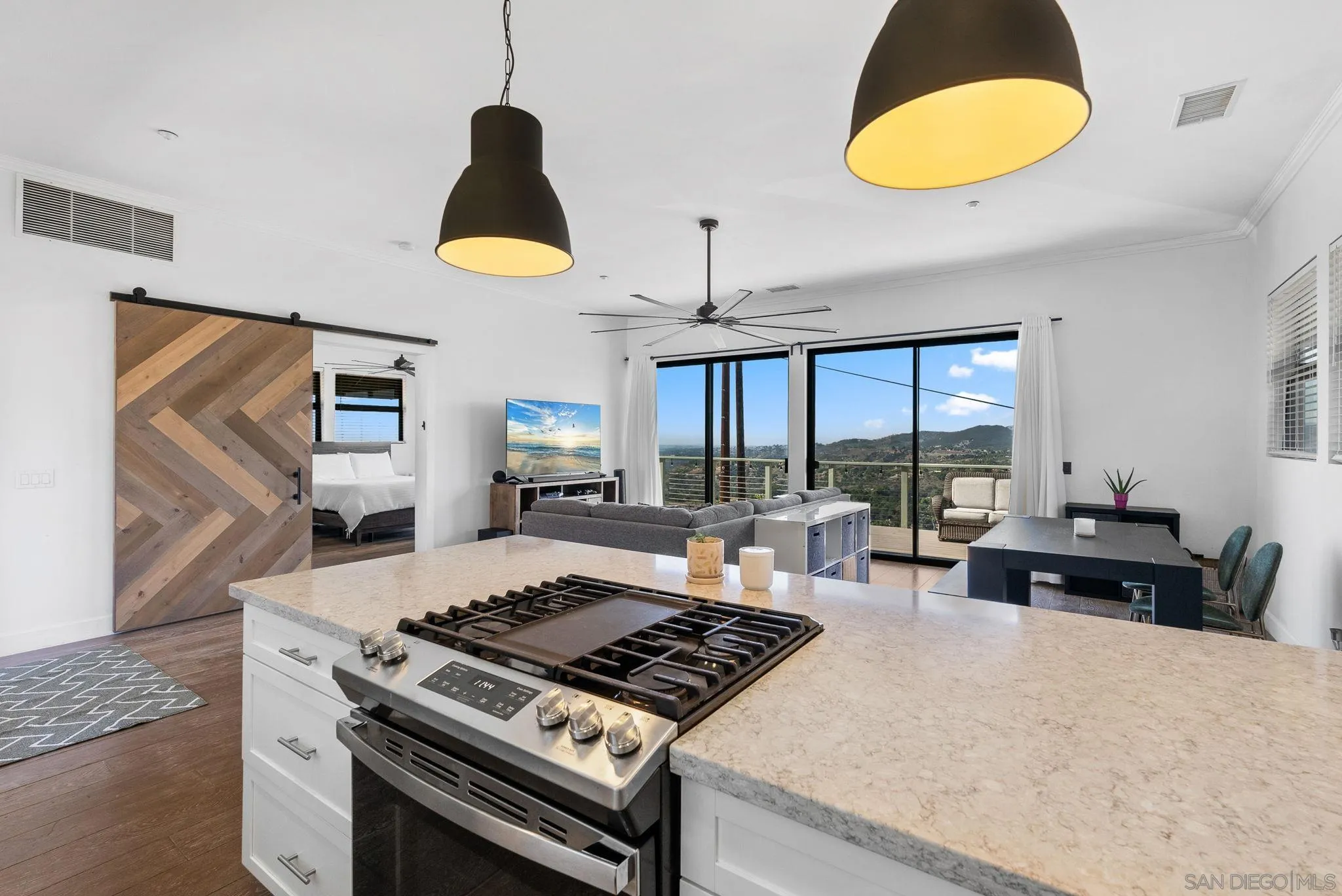 5521 Rainbow Heights Road Fallbrook, CA 92028 - Photo 10 of 36 a kitchen with a stove and a wooden floor