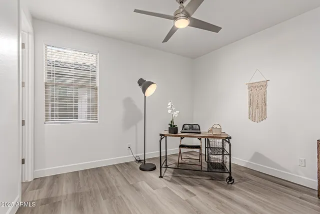 a view of an empty room and wooden floor