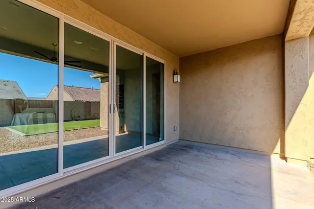 an aerial view of a house with a swimming pool outdoor seating and yard
