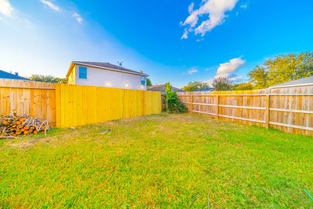 a view of a swimming pool with an outdoor space and seating area