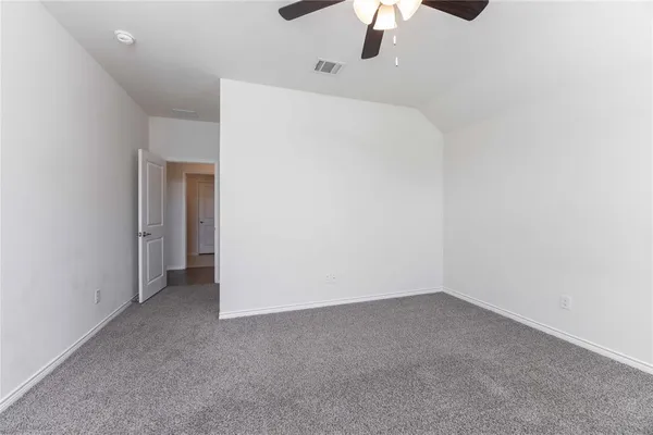a view of a room with a ceiling fan