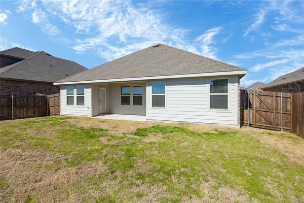 a house with yard in front of it