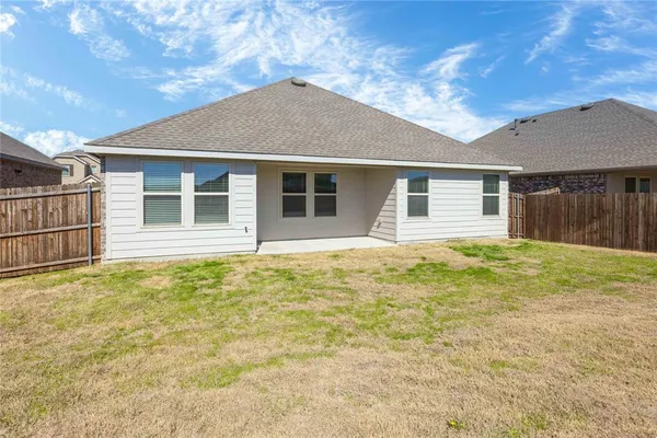 a house with yard in front of it