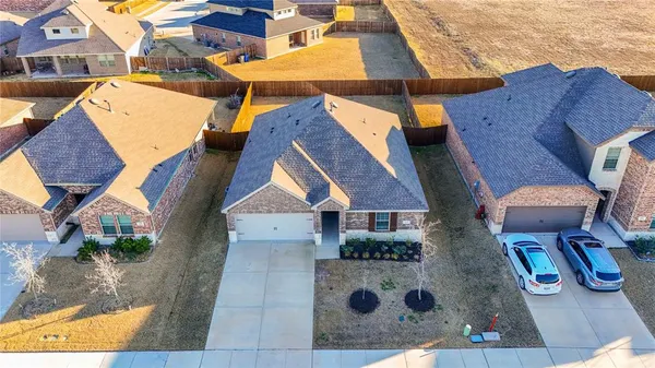 an aerial view of house with yard