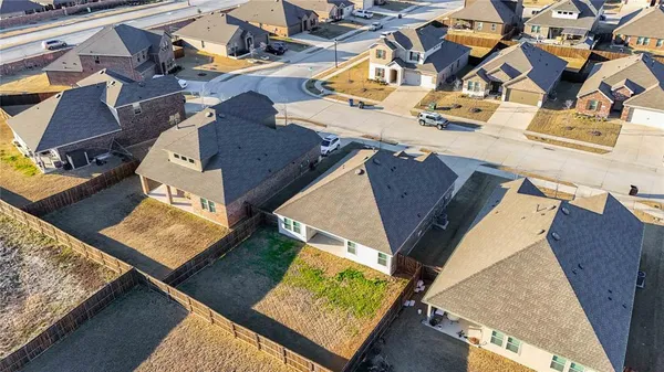 an aerial view of a house with a ocean view