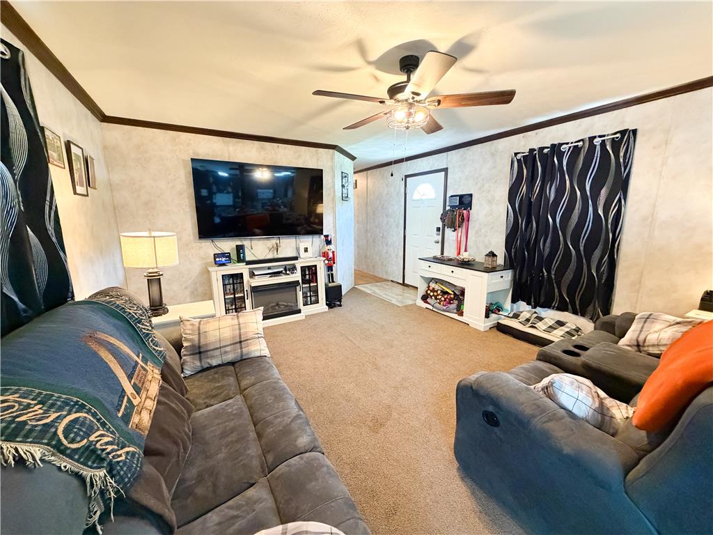 49 Ritz Craft Street Walnutport, PA 18088 - Photo 7 of 17 A well-lit gathering space offers a comfortable living area, perfect for relaxation and entertainment.