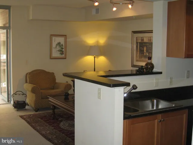 a kitchen with stainless steel appliances a refrigerator a stove a microwave and cabinets