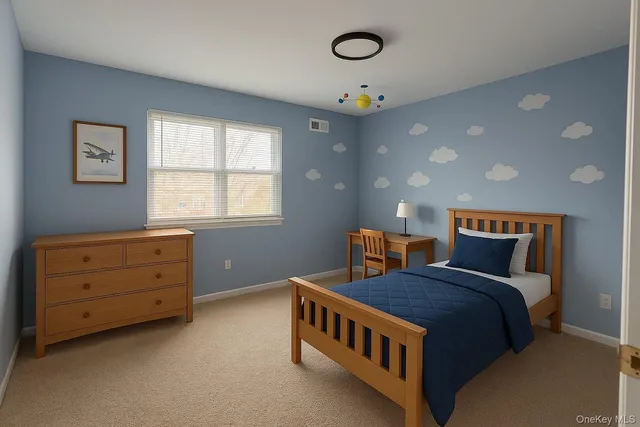 a spacious bedroom with a bed and a window