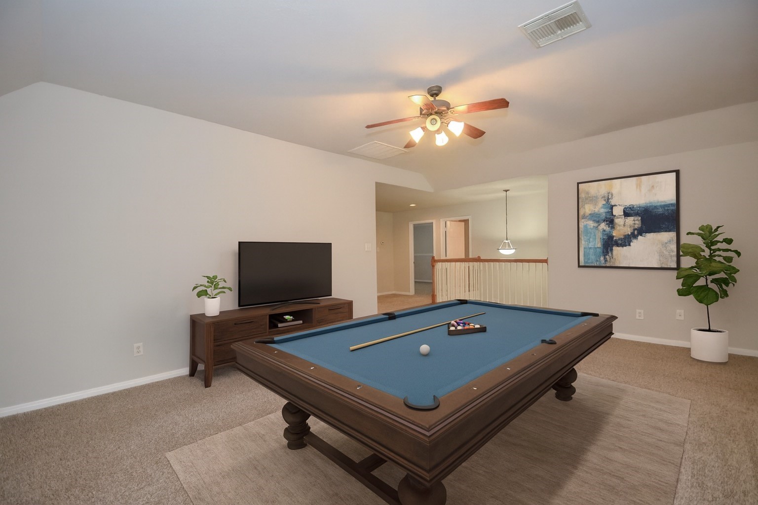 4907 Trailing Clover Court Houston, TX 77084 - Photo 7 of 15 a living room with pool table and a flat screen tv
