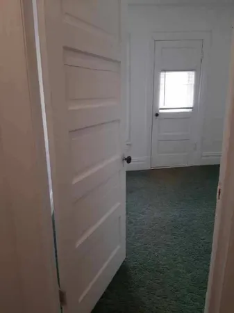 a kitchen with a sink a stove and cabinets