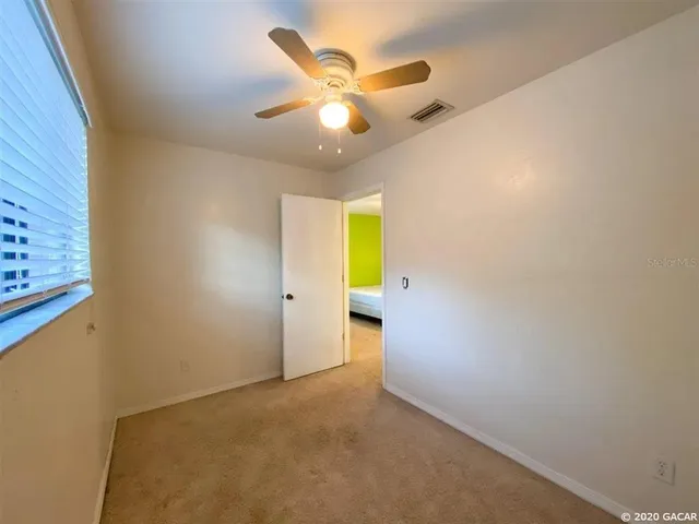 a kitchen with stainless steel appliances granite countertop a refrigerator a stove a sink and dishwasher