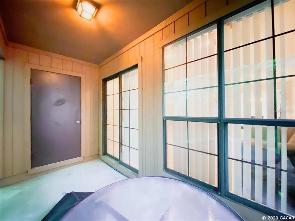 5855 Southwest 8th Place Gainesville, FL 32607 - Photo 15 of 19 a bedroom with windows