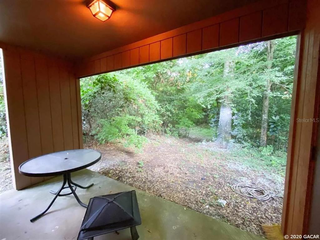 5855 Southwest 8th Place Gainesville, FL 32607 - Photo 16 of 19 a view of a lounge chair in the balcony