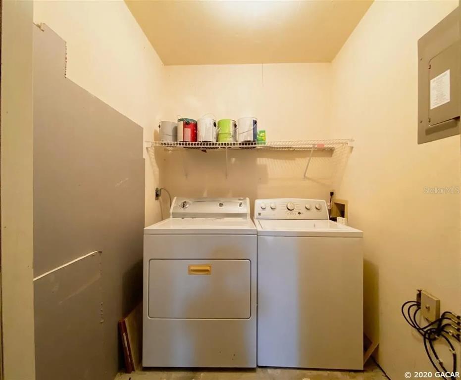 5855 Southwest 8th Place Gainesville, FL 32607 - Photo 17 of 19 a utility room with dryer and washer