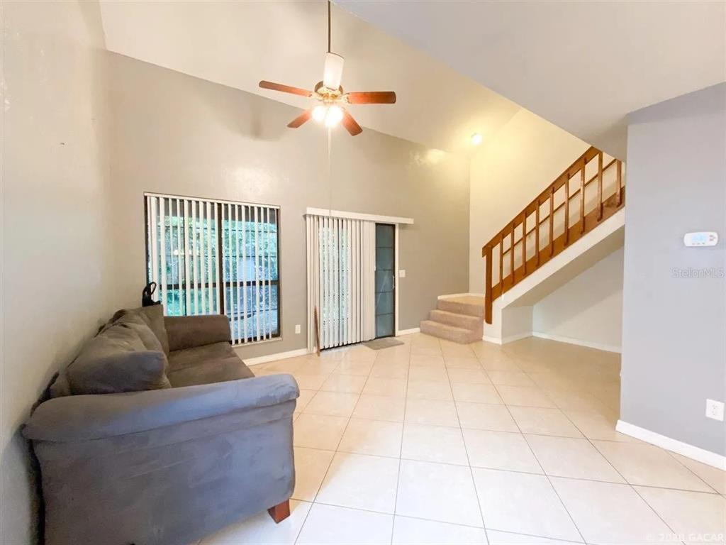 5855 Southwest 8th Place Gainesville, FL 32607 - Photo 2 of 19 a living room with furniture and a large window