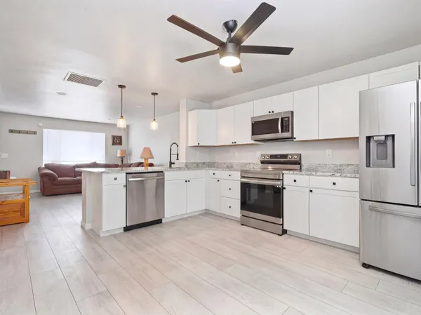 a kitchen with a stove oven and a refrigerator