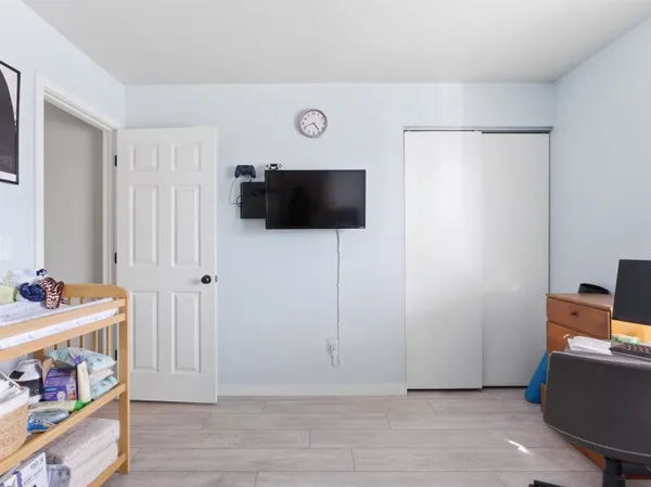 a view of room with furniture and flat screen tv