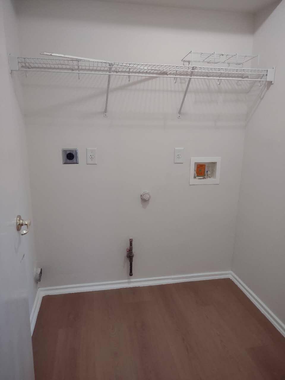 11709 Briarcreek Loop Manor, TX 78653 - Photo 14 of 19 Ready for appliances, this utility space includes hookups and durable flooring for daily tasks.