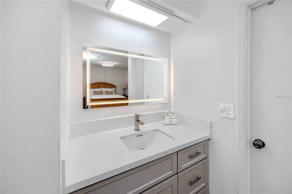 2207 Belleair Road, Unit B30 Clearwater, FL 33764 - Photo 17 of 39 a bathroom with a sink and a mirror