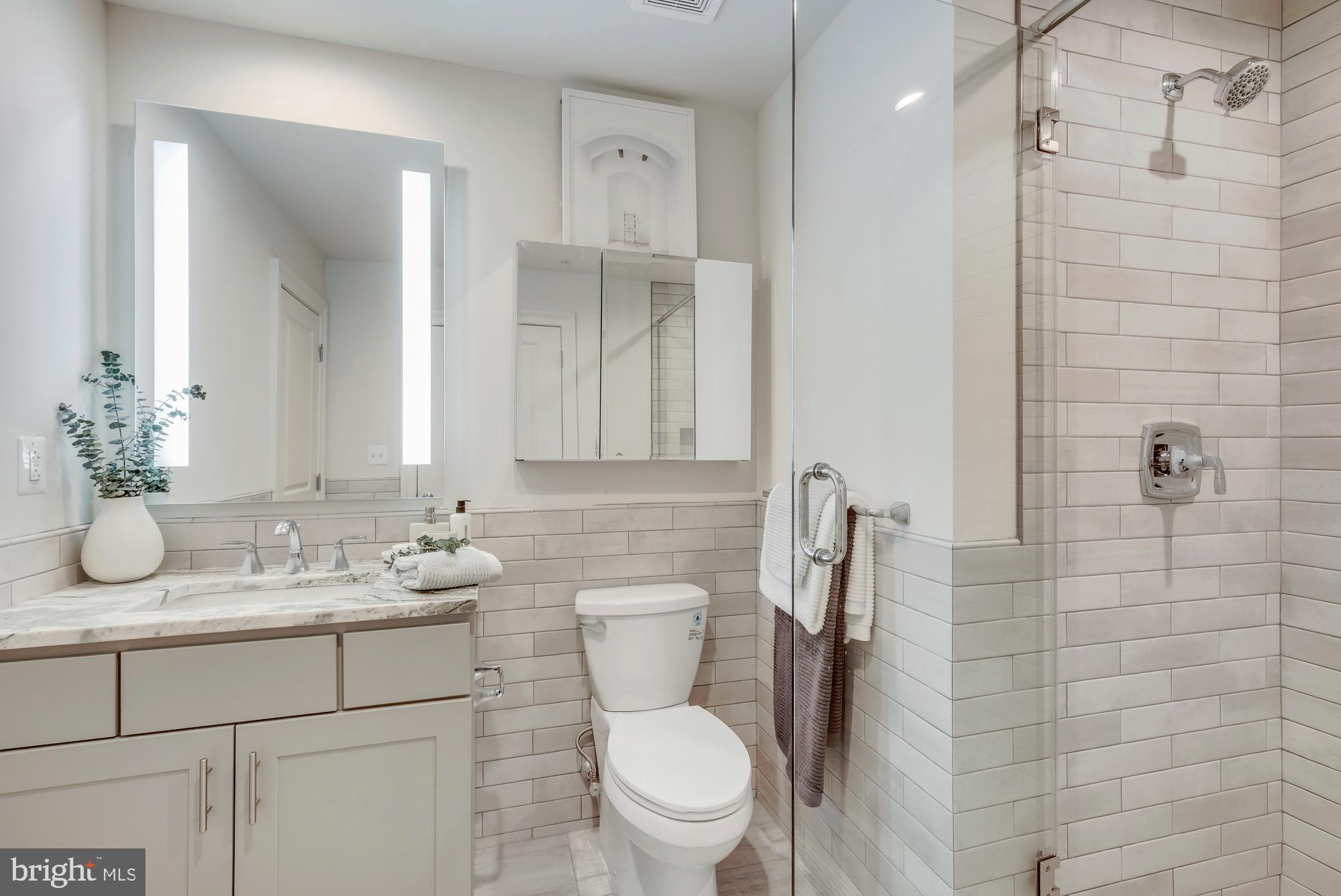 30 North 23rd Street, Unit 1808 Philadelphia, PA 19103 - Photo 23 of 42 a bathroom with a sink toilet and shower