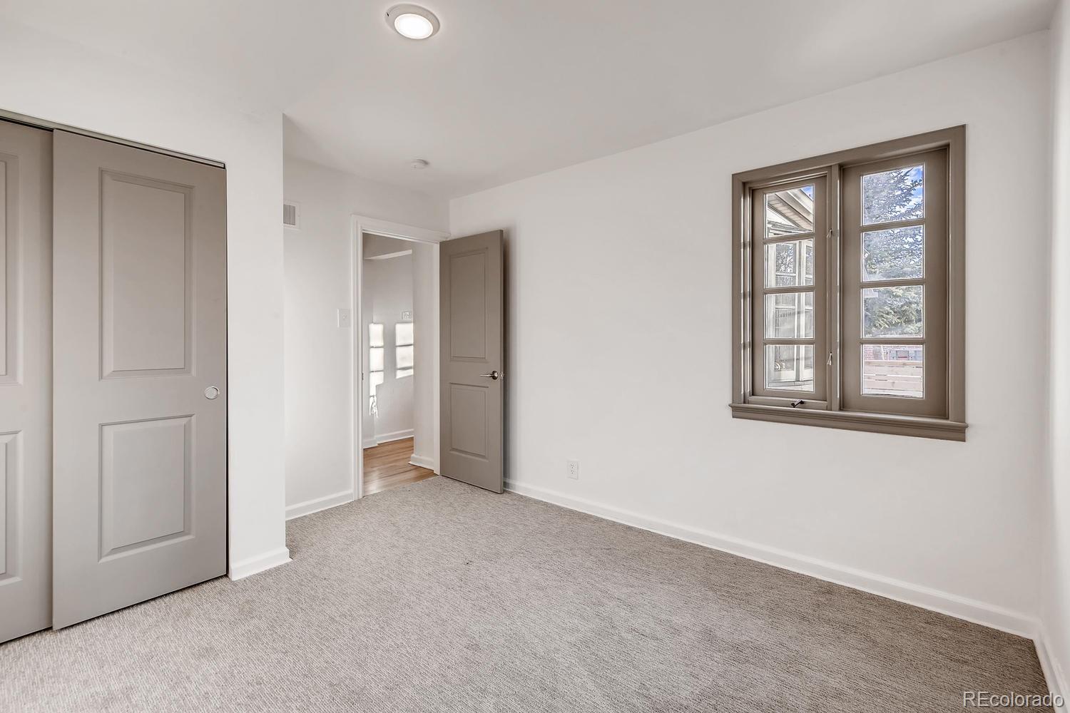 3906 Quay Street Wheat Ridge, CO 80033 - Photo 17 of 28 a view of an empty room with a window