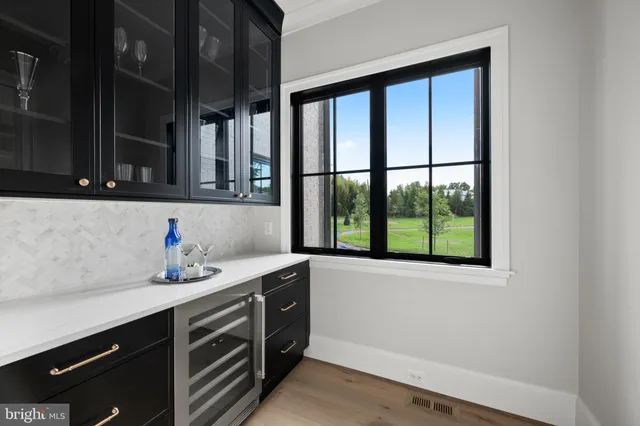 a view of entryway and hall with a floor to ceiling window