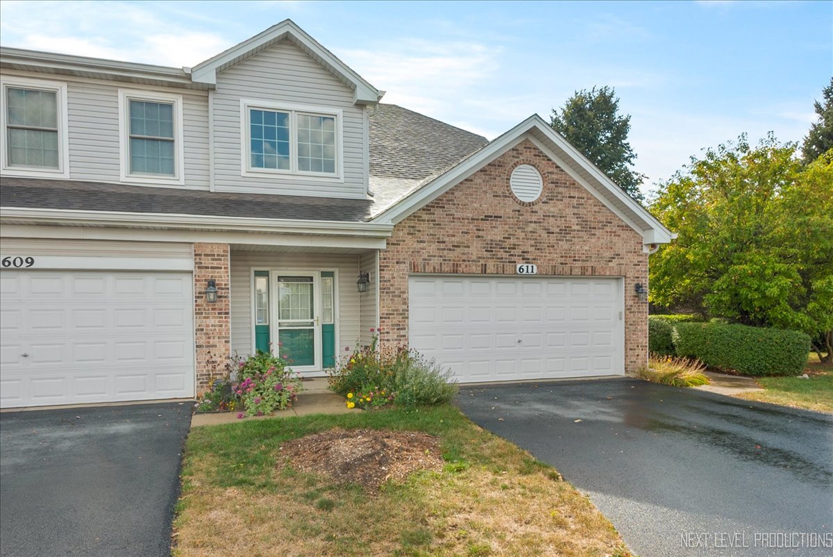 611 Waterview Court, Unit 611 Naperville, IL 60563 - Photo 1 of 16 front view of a house with a yard