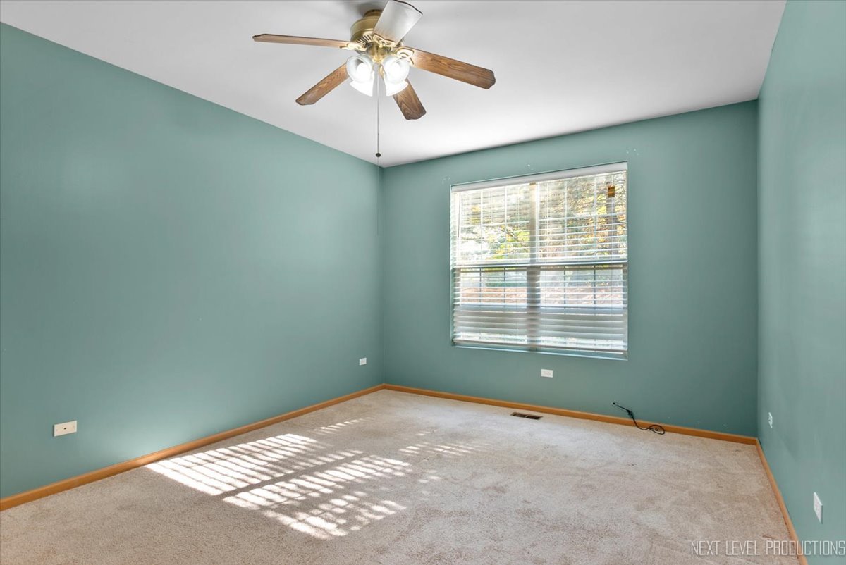 611 Waterview Court, Unit 611 Naperville, IL 60563 - Photo 12 of 16 a view of a big room with windows