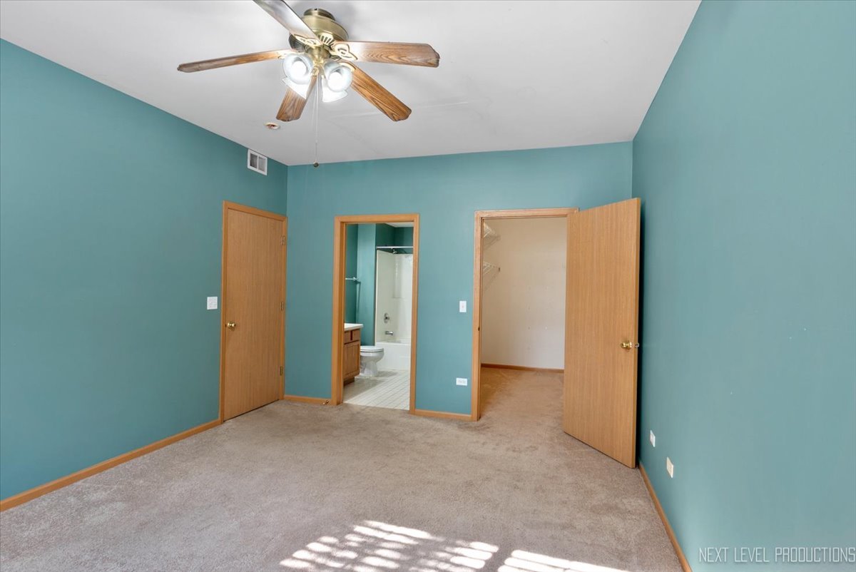 611 Waterview Court, Unit 611 Naperville, IL 60563 - Photo 14 of 16 a view of a livingroom with a chandelier fan