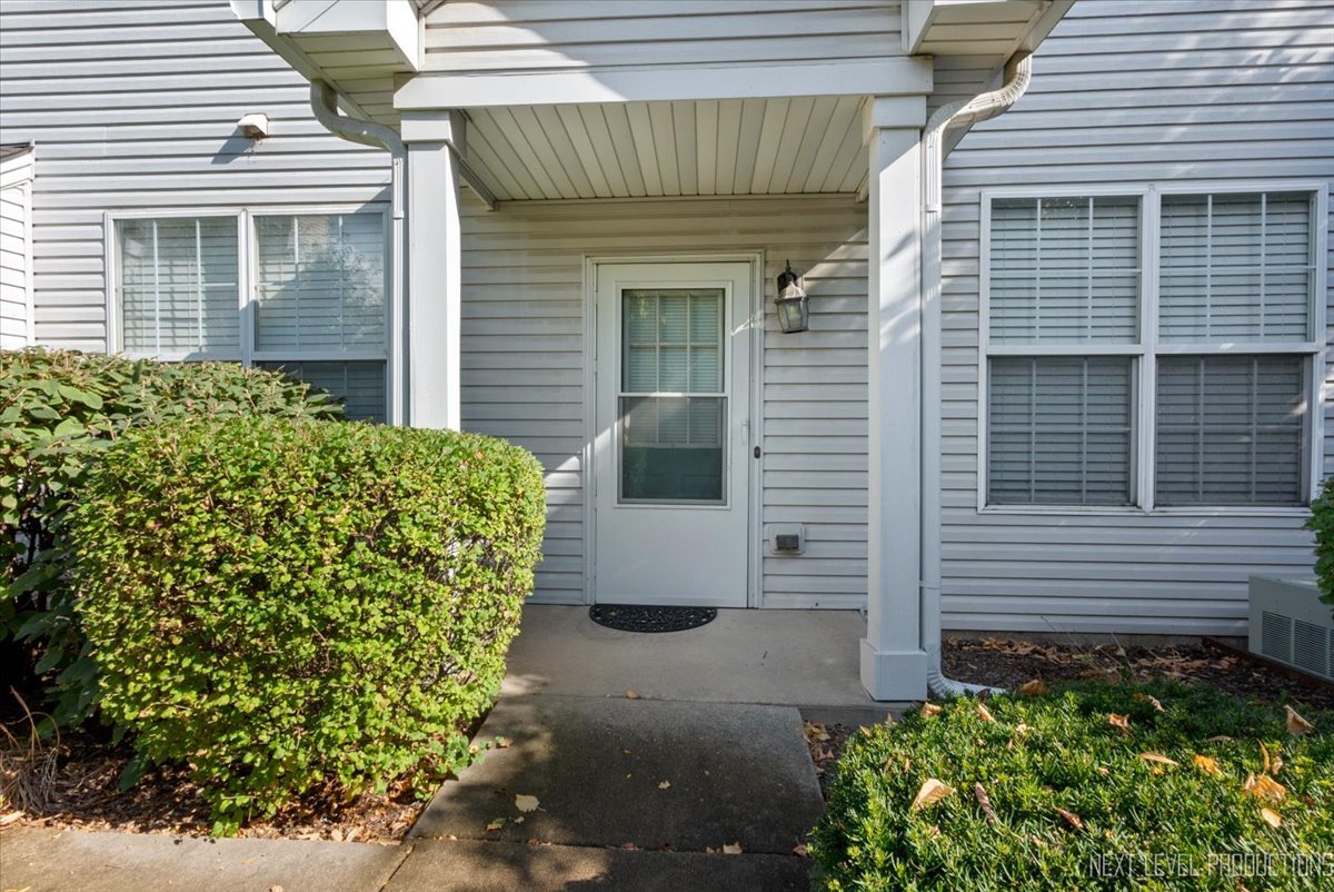 611 Waterview Court, Unit 611 Naperville, IL 60563 - Photo 16 of 16 a front view of a house with garden