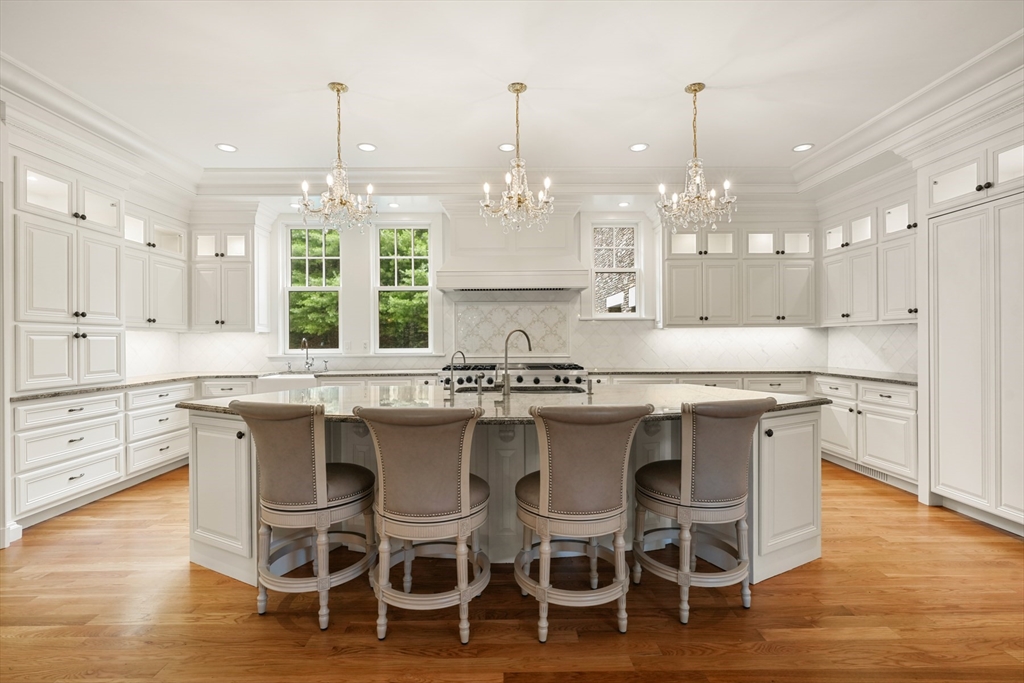 10 Wilson's Way Dover, MA 02030 - Photo 12 of 42 a kitchen with cabinets a sink dishwasher a dining table and chairs