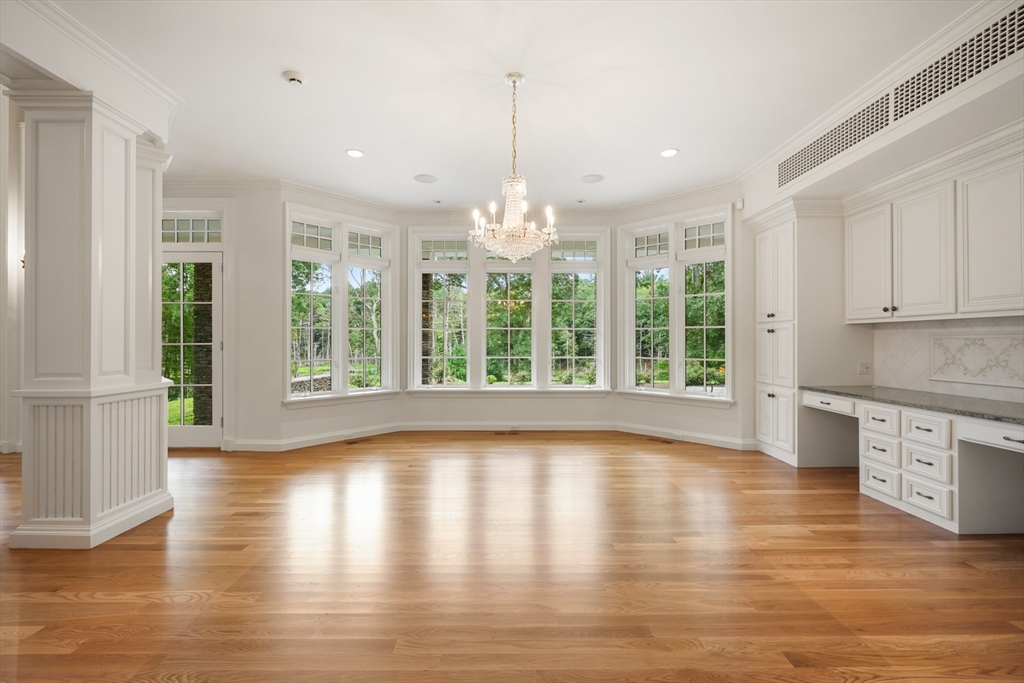 10 Wilson's Way Dover, MA 02030 - Photo 15 of 42 a view of wooden floor and windows in a room