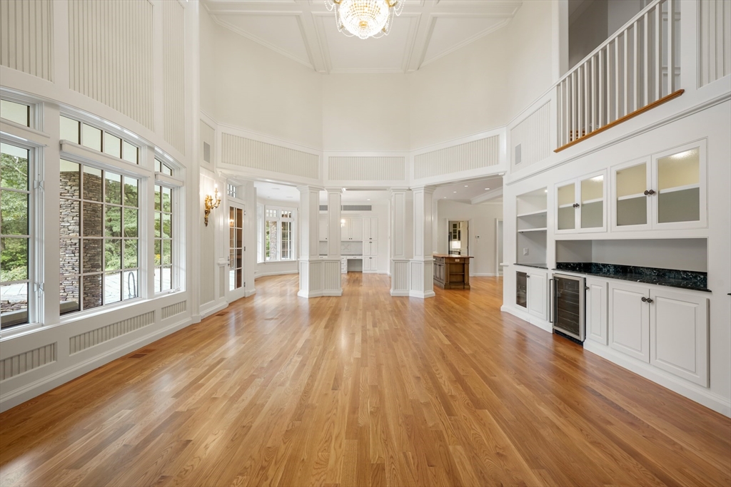 10 Wilson's Way Dover, MA 02030 - Photo 17 of 42 a large space with chandelier and wooden floors
