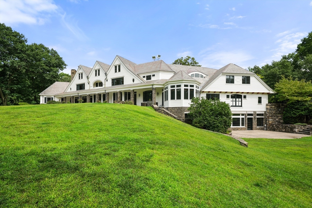 10 Wilson's Way Dover, MA 02030 - Photo 3 of 42 a front view of a house with garden and trees