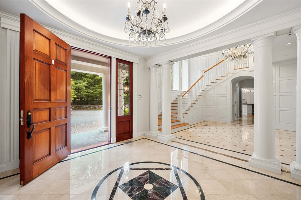10 Wilson's Way Dover, MA 02030 - Photo 5 of 42 a view of a hallway with entryway windows and a chandelier