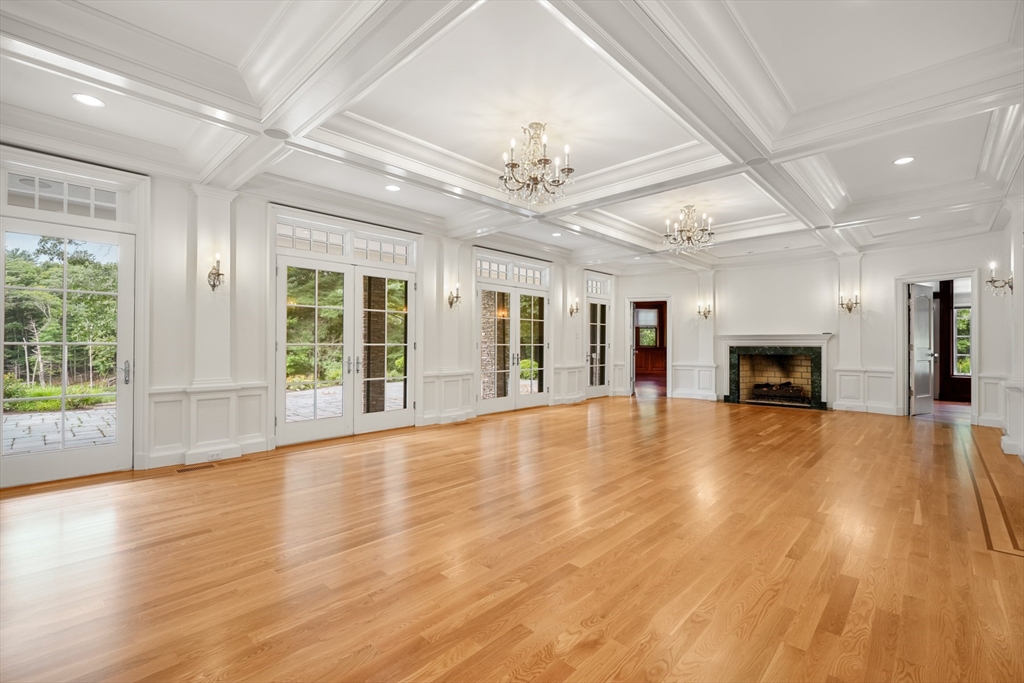 10 Wilson's Way Dover, MA 02030 - Photo 8 of 42 a view of an empty room with wooden floor and a window