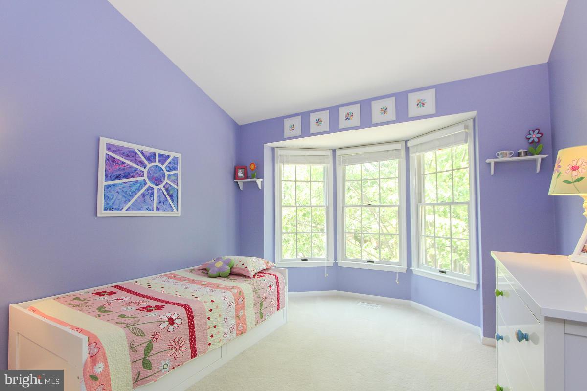 12666 Granite Ridge Drive North Potomac, MD 20878 - Photo 18 of 30 a bedroom with a bed and a large window