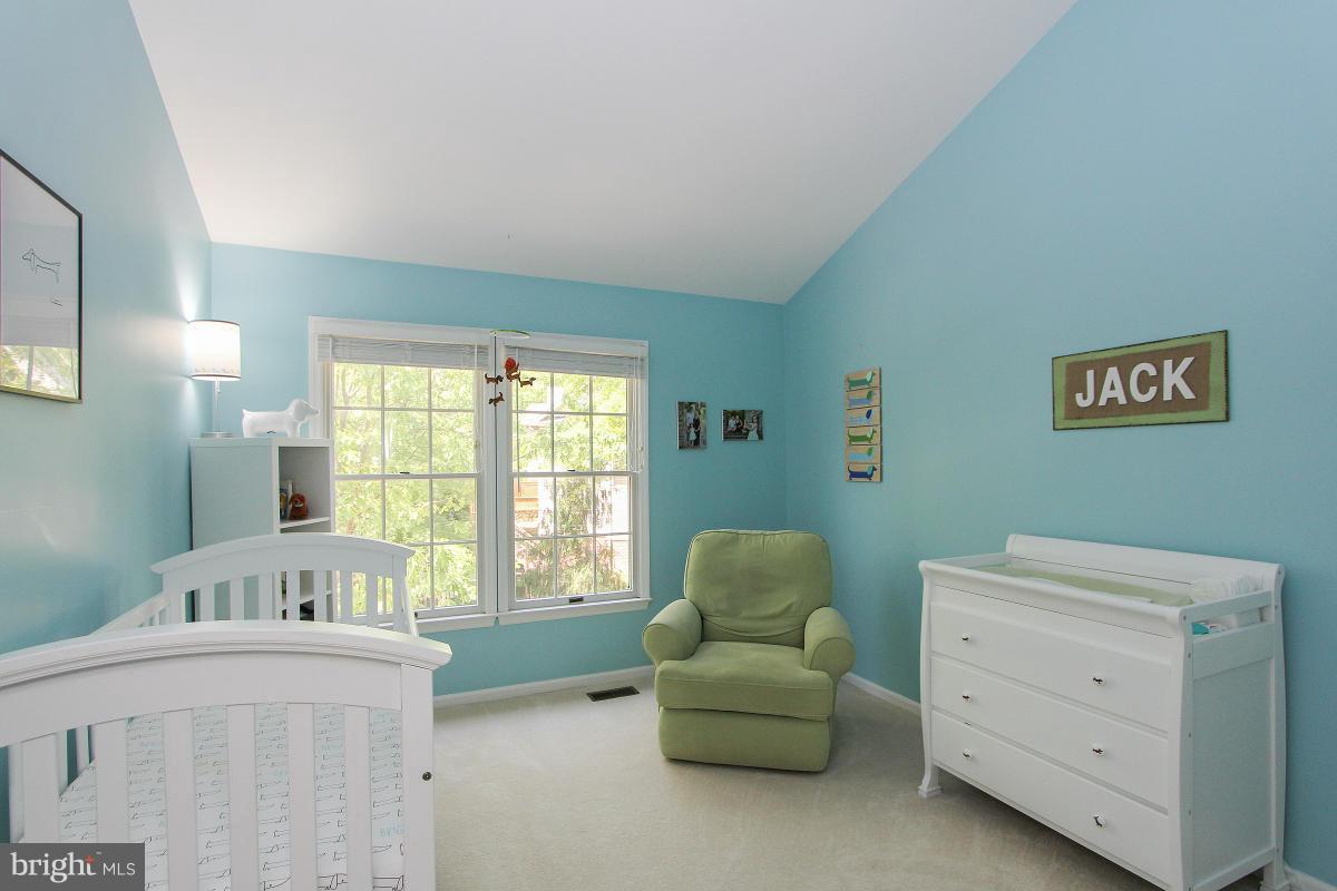12666 Granite Ridge Drive North Potomac, MD 20878 - Photo 19 of 30 a spacious bedroom with a bed and a window