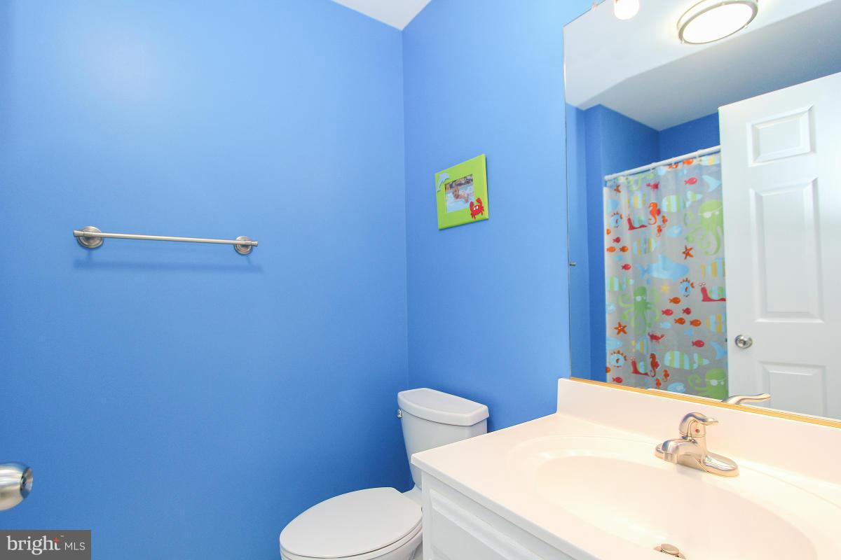 12666 Granite Ridge Drive North Potomac, MD 20878 - Photo 20 of 30 a bathroom with a sink and a mirror