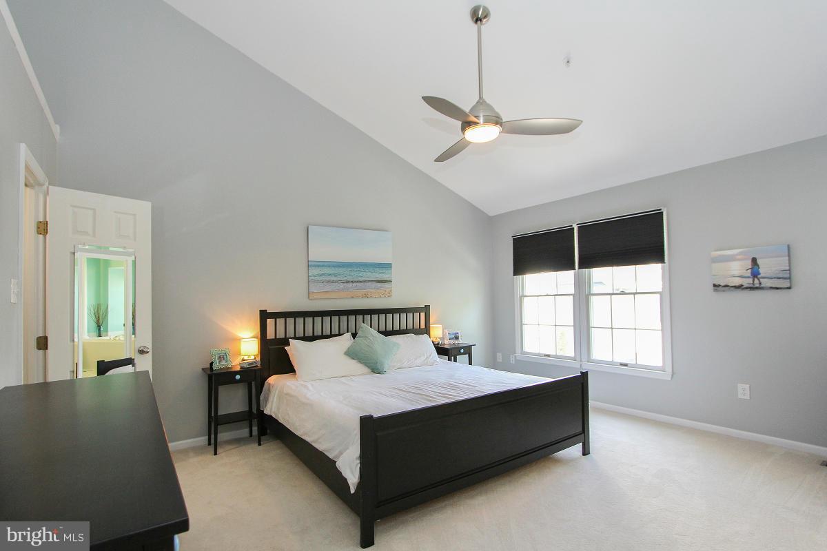 12666 Granite Ridge Drive North Potomac, MD 20878 - Photo 21 of 30 a spacious bedroom with a bed and window