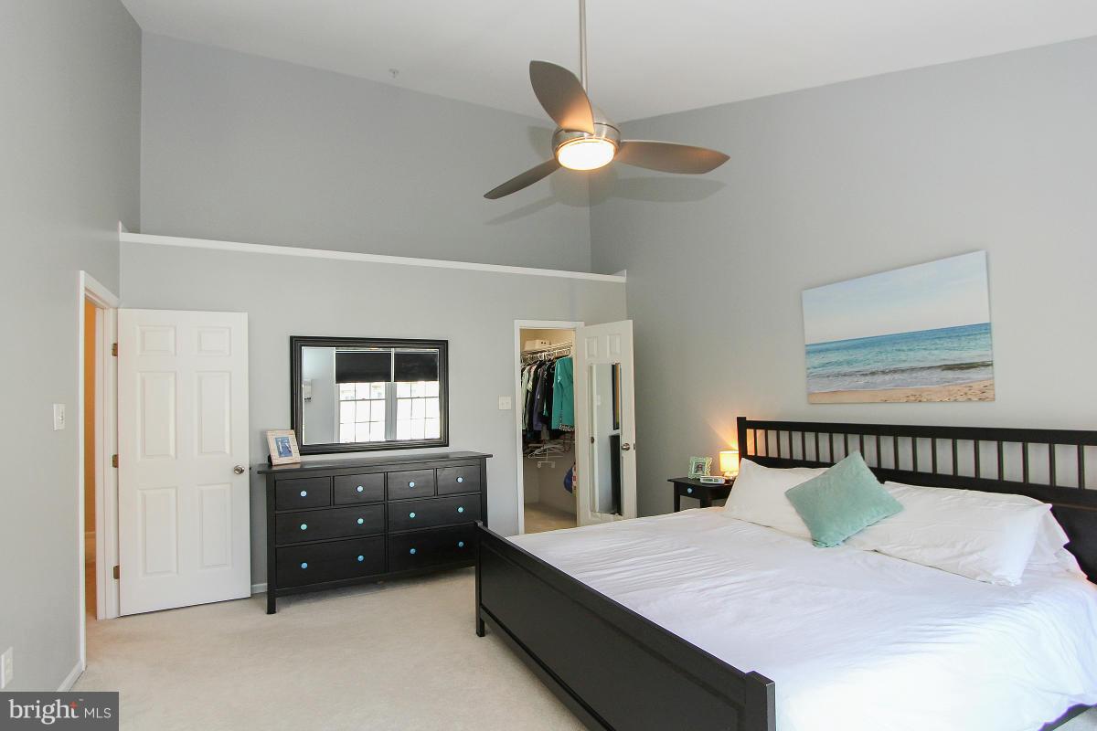 12666 Granite Ridge Drive North Potomac, MD 20878 - Photo 22 of 30 a spacious bedroom with a bed and window