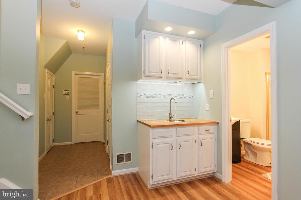 12666 Granite Ridge Drive North Potomac, MD 20878 - Photo 25 of 30 a bathroom with a sink a toilet and a window