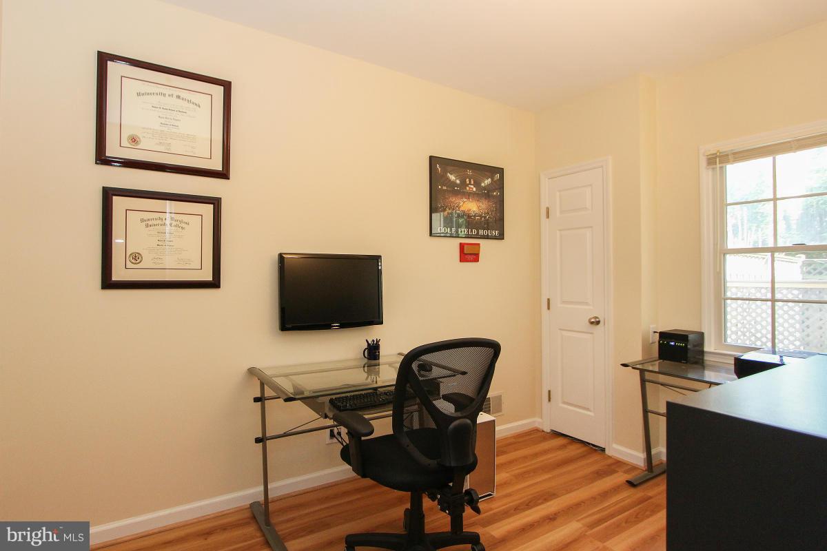 12666 Granite Ridge Drive North Potomac, MD 20878 - Photo 26 of 30 a view of a workspace with furniture and a window