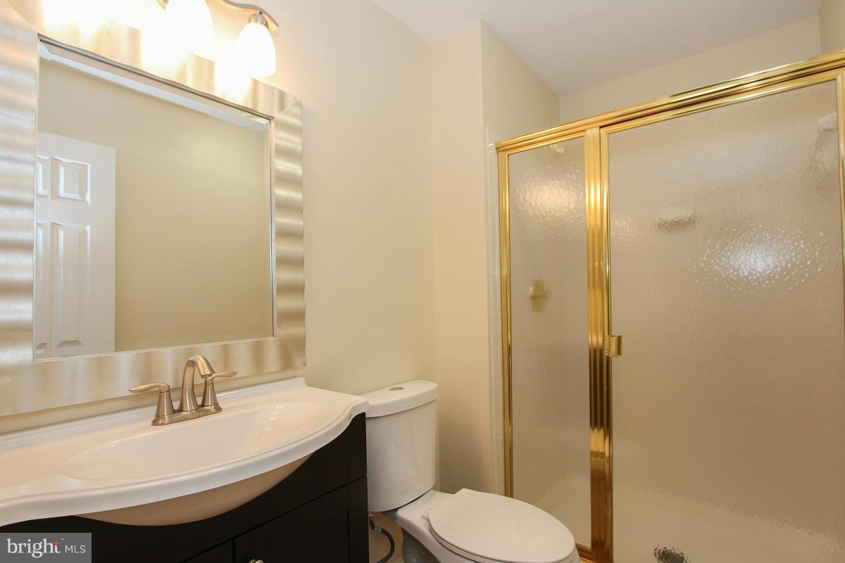 12666 Granite Ridge Drive North Potomac, MD 20878 - Photo 27 of 30 a bathroom with a sink toilet and shower