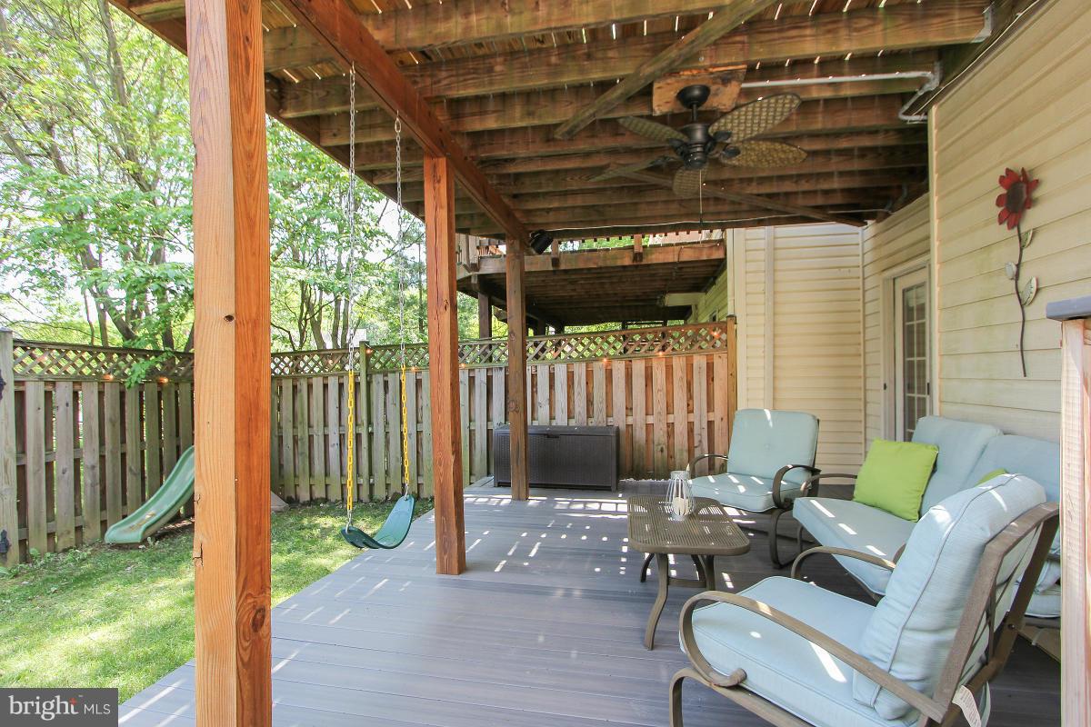 12666 Granite Ridge Drive North Potomac, MD 20878 - Photo 28 of 30 a patio with glass top table and chairs