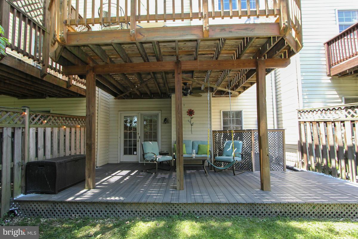 12666 Granite Ridge Drive North Potomac, MD 20878 - Photo 29 of 30 a view of a porch with furniture and wooden floor