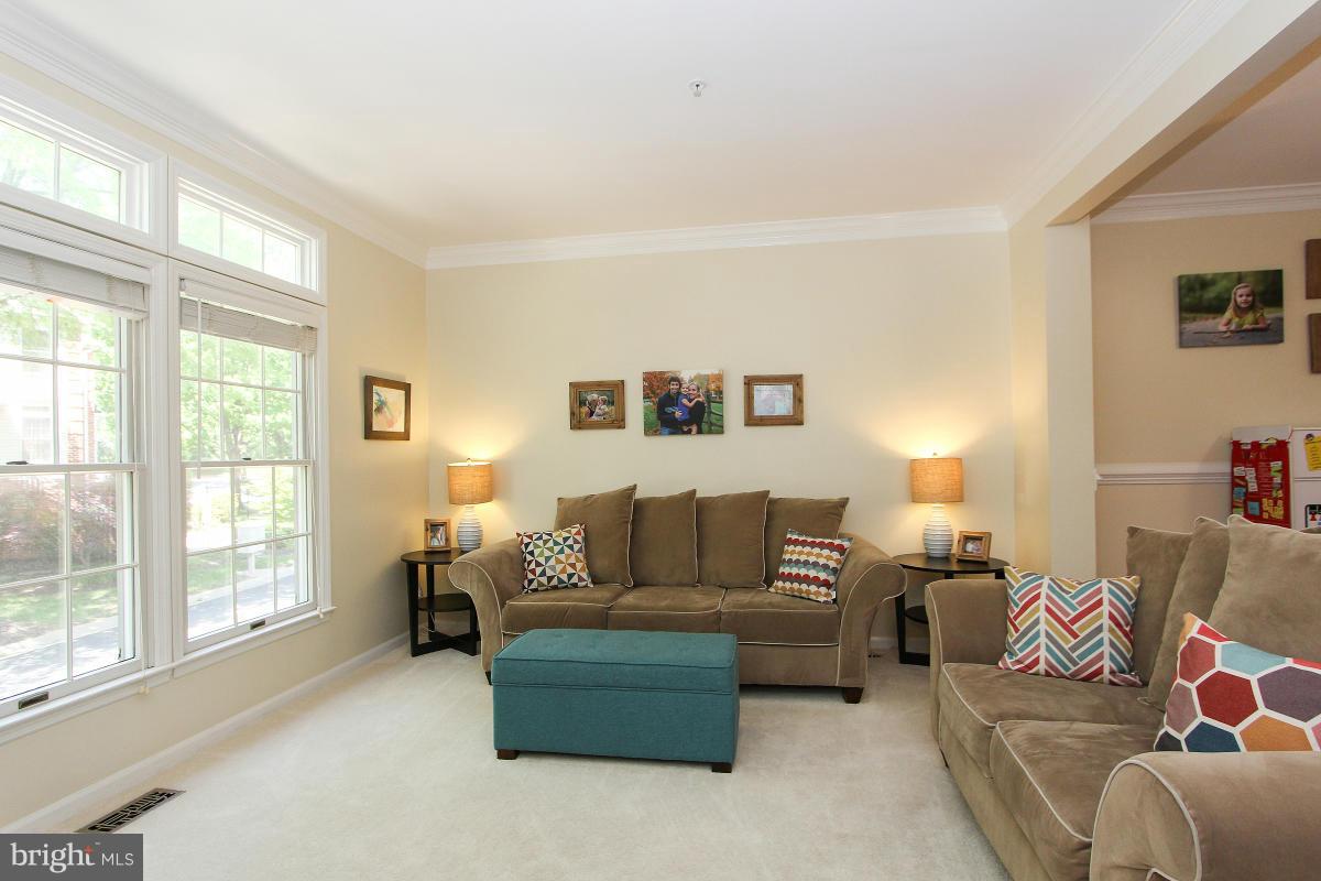 12666 Granite Ridge Drive North Potomac, MD 20878 - Photo 4 of 30 a living room with furniture and a window